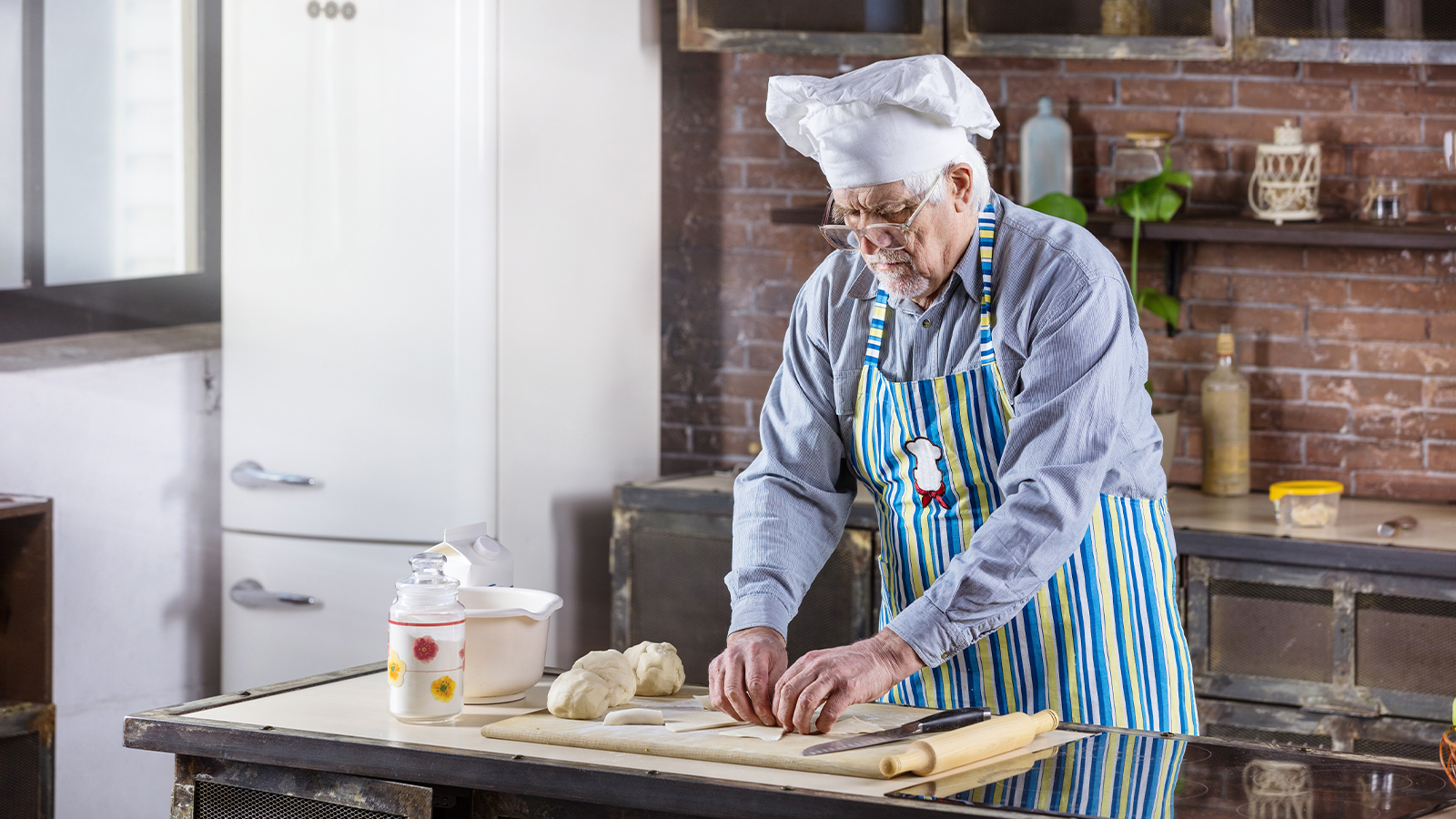 Senior with dementia preparing food at home