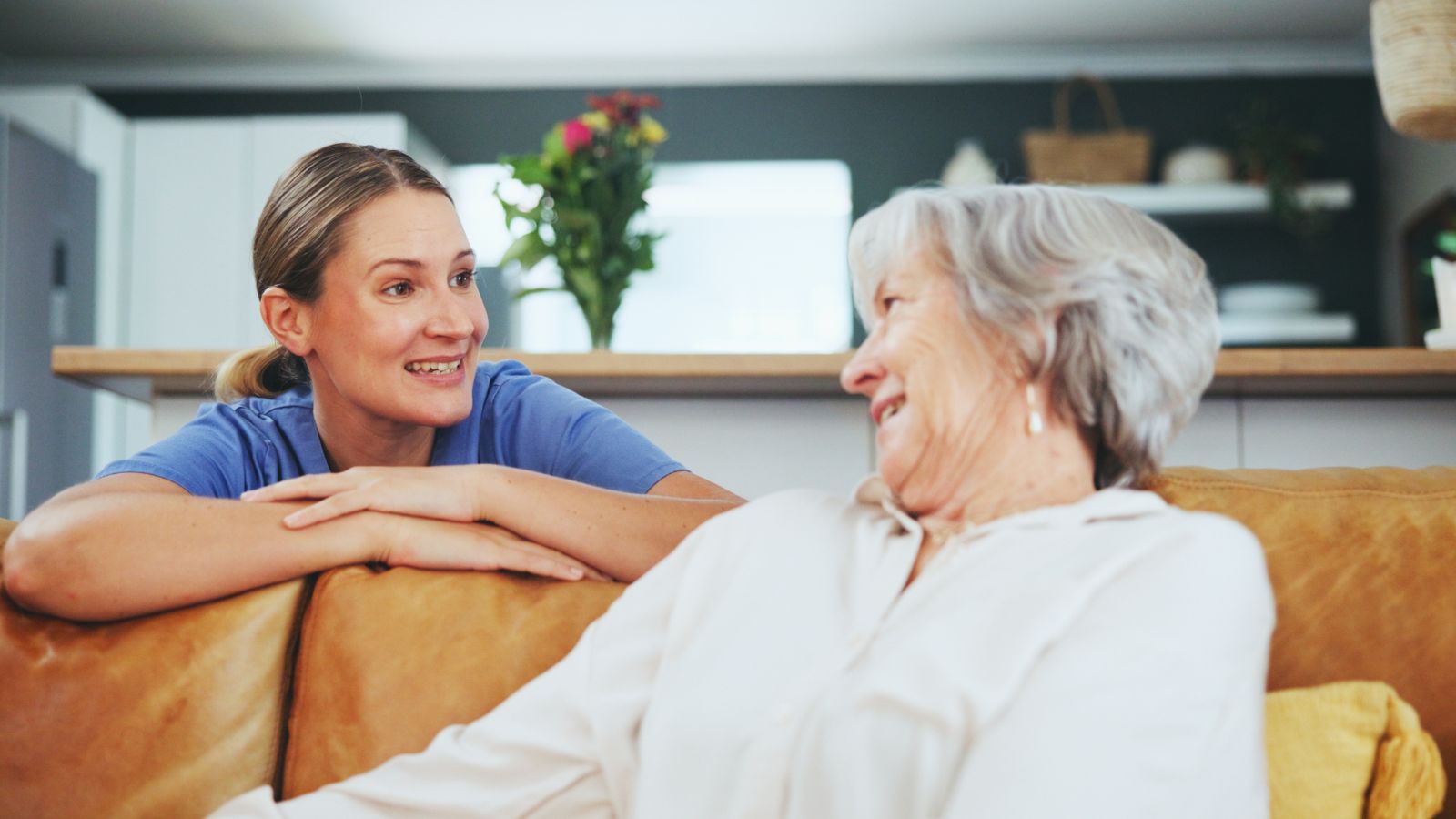 24 hour home caregiver talking to senior in Houston